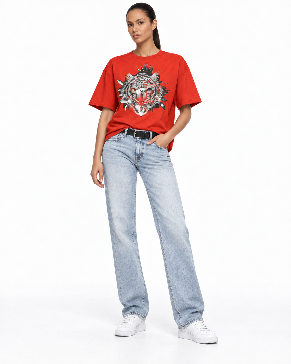 Model wearing a red graphic T-shirt and light blue jeans, pose 3